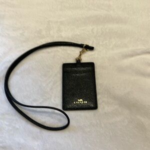 New Coach lanyard black with gold.